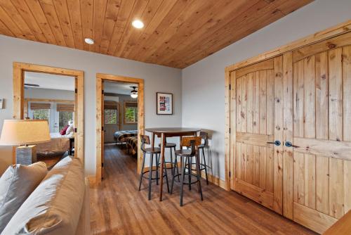 a living room with a couch and a table at Wildcat Chalet in Seven Devils