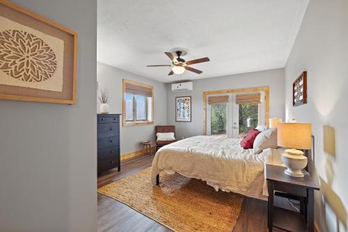 a bedroom with a bed and a ceiling fan at Wildcat Chalet in Seven Devils