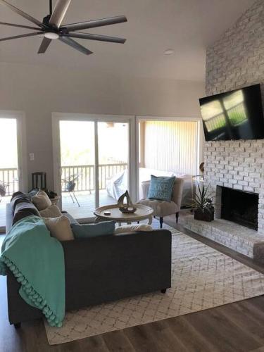 a living room with a couch and a fireplace at Lake Travis Oasis next to Pool, Marina, Boat ramp in Leander