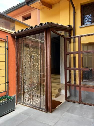 an entrance to a house with an iron gate at La Nicchia in Imola