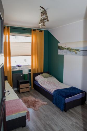 Postel nebo postele na pokoji v ubytování Pirs Apartament Gdynia - apartament na wyłączność