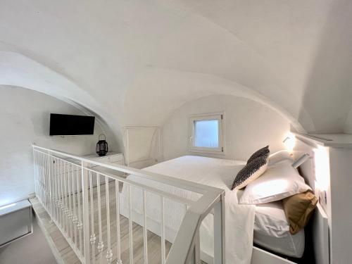 Кровать или кровати в номере CORTE DEI GOTHI - TREB Collection