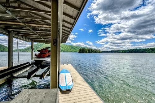 a boat is parked at a dock on a lake at Our Point of View in Huddleston