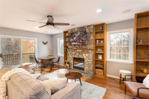 a living room with a couch and a fireplace at Whiskey Ridge in Boone