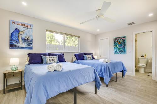 two beds in a room with blue sheets at Fort Lauderdale Vacation Rental about 8 Mi to Beaches! in Fort Lauderdale