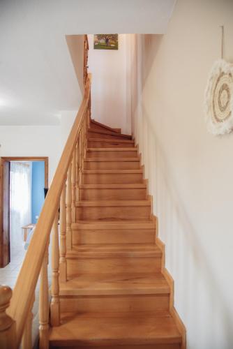 a staircase in a house with wooden floors at BS Village in Metamorfosi