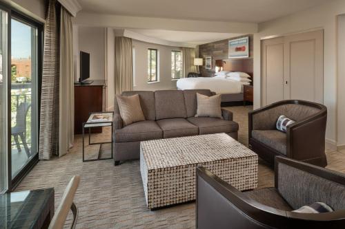 a living room with a couch and a bed at Sheraton Park City in Park City