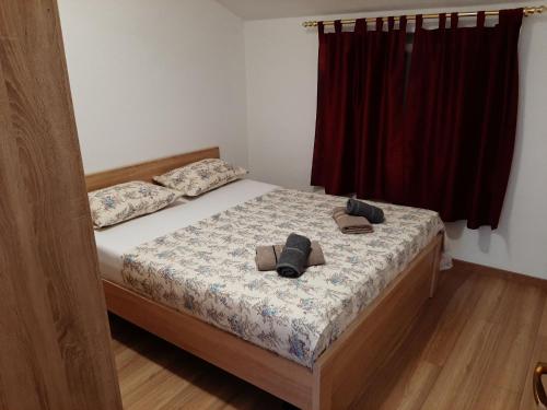 Katil atau katil-katil dalam bilik di Apartmani Šegedin