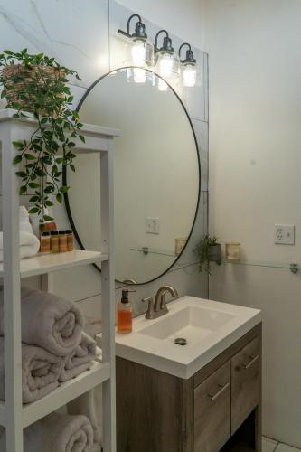 a bathroom with a sink and a mirror at CASA MARIA - BEACHFRONT COTTAGE ON THE SAND in Ensenada