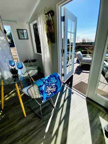 a porch with a chair and an open door at 30 PCT OFF! Malibu Serene Cabin, Ocean View, Beach in Malibu