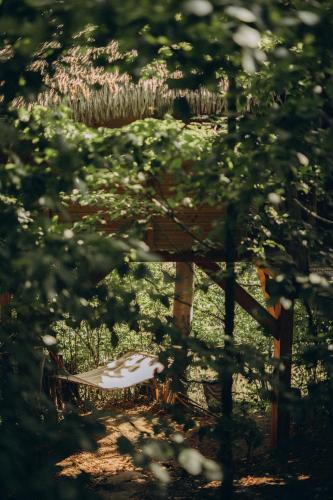a bird cage sitting in the middle of a yard at Wild House Donovaly in Donovaly