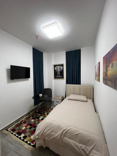 Un pat sau paturi într-o cameră la BS Hotel