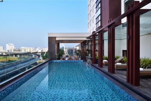 a swimming pool on the roof of a building at Fairfield by Marriott Kolkata in Kolkata