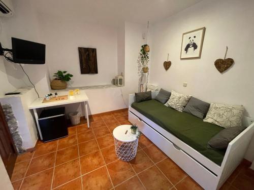 a living room with a couch and a table at Hotel Rural El Arca de Noé in El Tiemblo