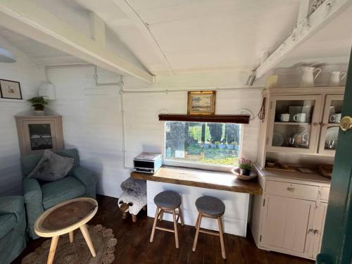 Shepherds Hut in enclosed field photo 14