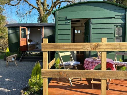Shepherds Hut in enclosed field photo 16