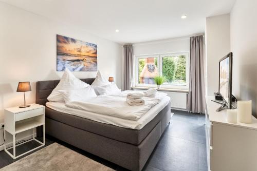 Postel nebo postele na pokoji v ubytování Haus Deepensoll 39 Große Auszeit
