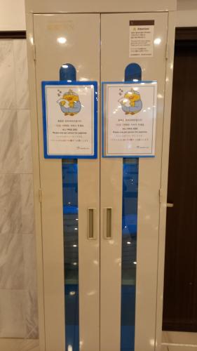 a display case with three signs on it at Toyoko Inn Busan Jungang Station in Busan