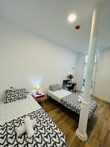 Ένα ή περισσότερα κρεβάτια σε δωμάτιο στο HOSTEL COSTA-LUZ Béjar 28-30