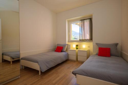 Postel nebo postele na pokoji v ubytování Residence Girasole Casa Gialla
