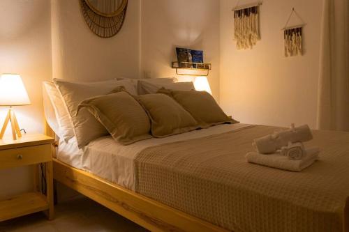 a bedroom with a bed with a stuffed animal on it at Martha's filoxenia in Drios