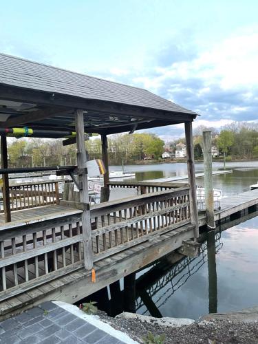 a wooden bridge over a body of water at One bedroom with modern kitchen, balcony with water view in Greenwich