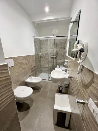 a bathroom with two sinks and a shower at Anfitrite B&B Tropea in Tropea