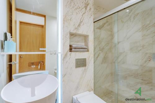 a bathroom with a shower and a toilet and a sink at Lovely & Spacious Apartment with Pool & Gym in La Condesa - Icon in Mexico City