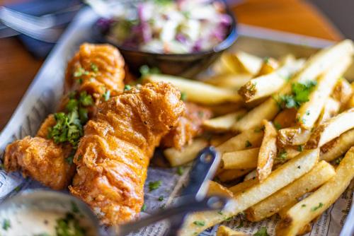 a tray of food with fried fish and french fries at Renaissance St. Augustine Historic Downtown Hotel in St. Augustine