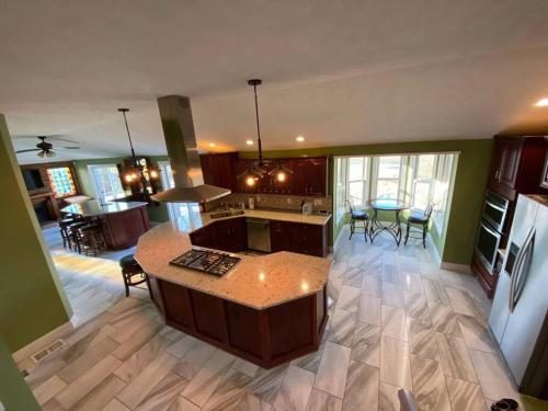 a kitchen with a island in the middle of a room at Salmon River View in Pulaski