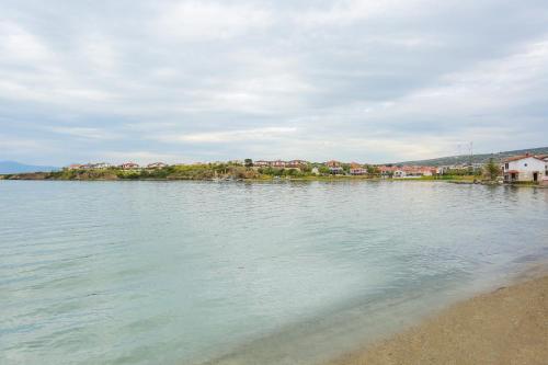 a view of a body of water with houses at River & Sea Villa in Cesme