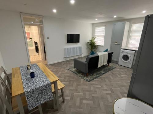 a living room with a couch and a table at Warwick Town Centre Property in Warwick