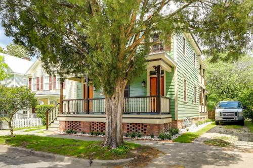 a green house with a tree in front of it at Victorian New Bern Vacation Rental In Downtown! in New Bern