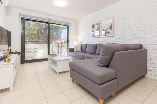 a living room with a couch and a chair at Mirabeau in Forster
