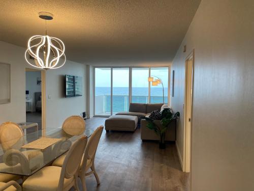 a living room with a table and a couch at MAGNIFICENT 2 bedroom /2 bath beachfront with Beach View Condo apartment in Hollywood
