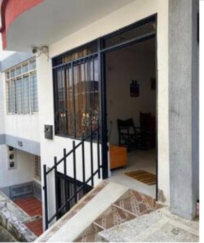 an open door of a house with a balcony at APARTAMENTO in Florencia