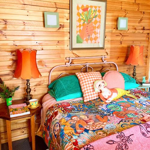 a bedroom with a bed with a doll on it at NOFOMO AT ADVENTURE BAY in Adventure Bay