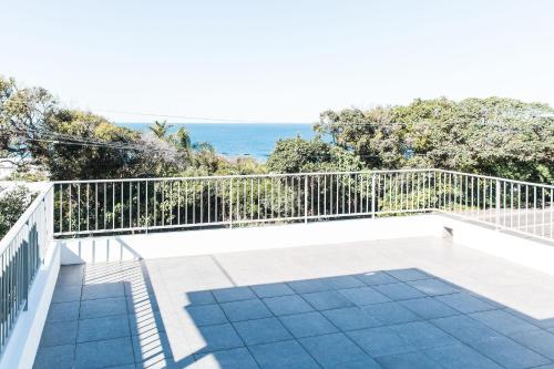 a balcony with a view of the ocean at Coastal Luxury, Private Pool, Ocean Vista in Sunshine Beach
