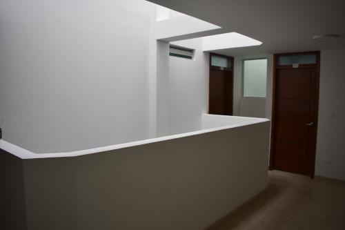 a kitchen with a white counter top in a room at Dorado Plaza in Zipaquirá