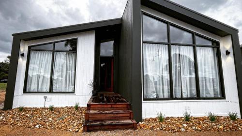 a small house with black and white at 32 Plateau in Metung