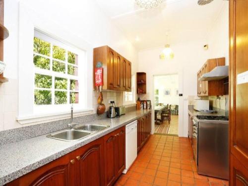 a kitchen with a sink and a counter top at York Cottage. A Country Retreat in Burradoo. in Burradoo