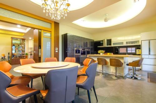 a kitchen and dining room with a table and chairs at Relax BnB in Dongshan