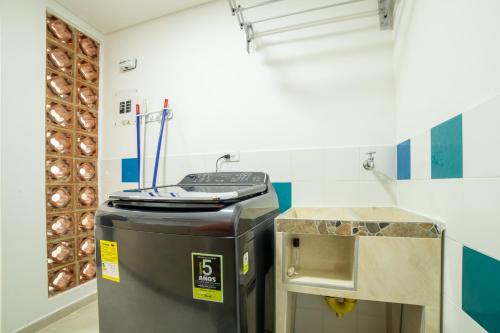 a trash can in a room with a counter at Edificio Vida Nueva in Cali