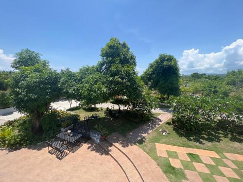 an overhead view of a park with benches and trees at La Plumerias in Moalboal