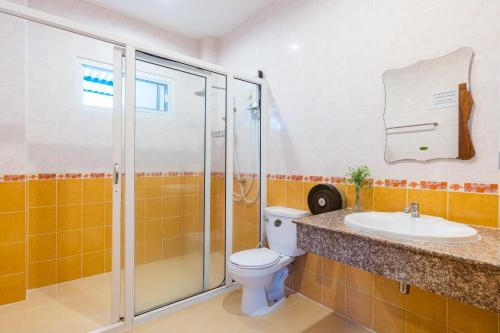 a bathroom with a shower and a toilet and a sink at Fira villa Huahin in Hua Hin