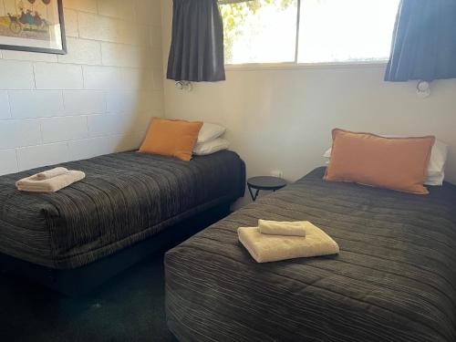 Voodi või voodid majutusasutuse Golden Leaf Apartments toas