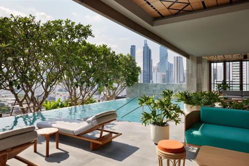 a pool on the roof of a building at dusitD2 Samyan Bangkok in Bangkok