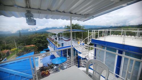 a balcony of a cruise ship with a slide at Hotel spa la buena vida in Fusagasuga