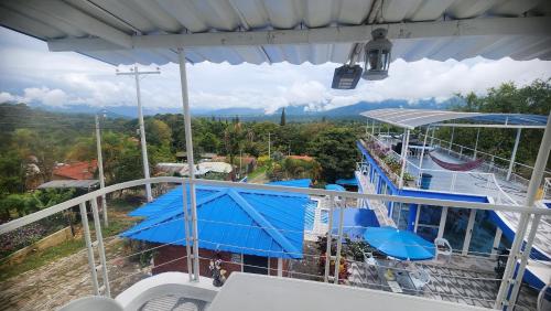 a balcony of a cruise ship with a slide at Hotel spa la buena vida in Fusagasuga