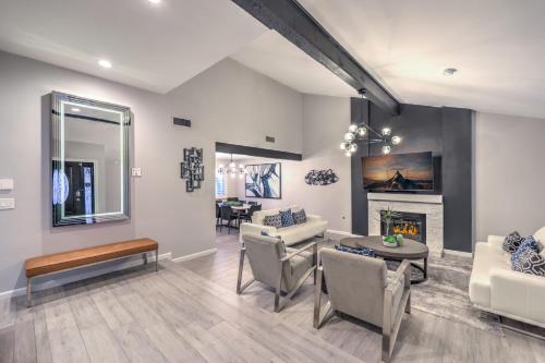 a living room with white furniture and a fireplace at Vegas Pool w Wetdeck, Jacuzzi, Wetbar, BBQ, 15 min to Strip in Las Vegas